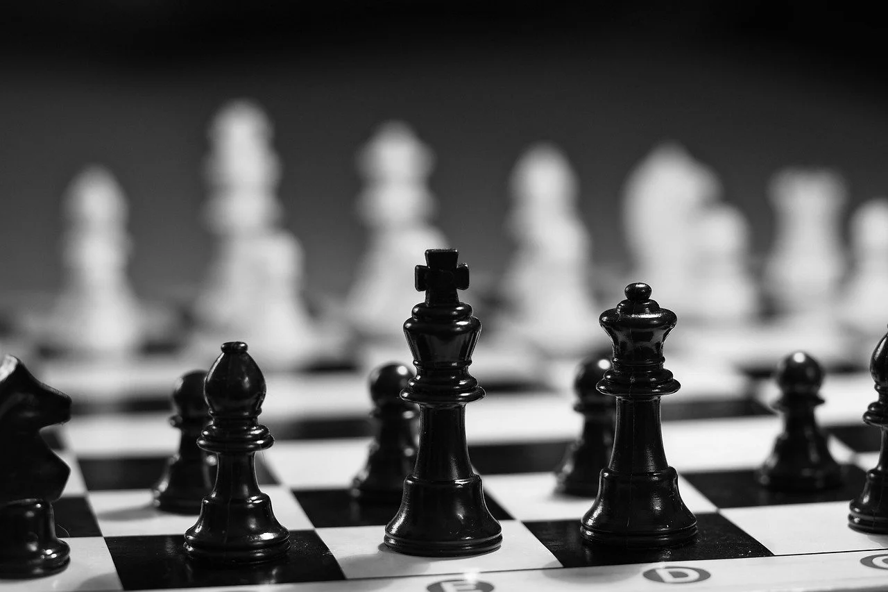 Abstract, minimalist representation of knowledge or problem-solving, featuring interconnected luminous geometric shapes converging towards a central, glowing orb of light.